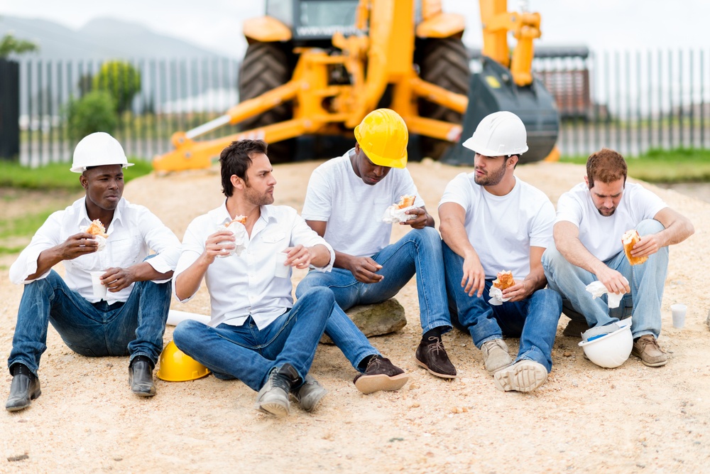 Group of construction workers on a break at a building site.jpeg